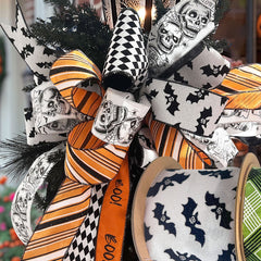 Halloween wired ribbons with skulls, bats, and festive patterns, arranged as bows. Perfect for Halloween decor & crafts at LaRibbons and Crafts.
