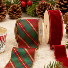 Two spools of holiday wired ribbon—plaid (red/green/gold) and red velvet—with pine cones, evergreens. Ideal for Christmas wrapping, wreaths at LaRibbons and Crafts.