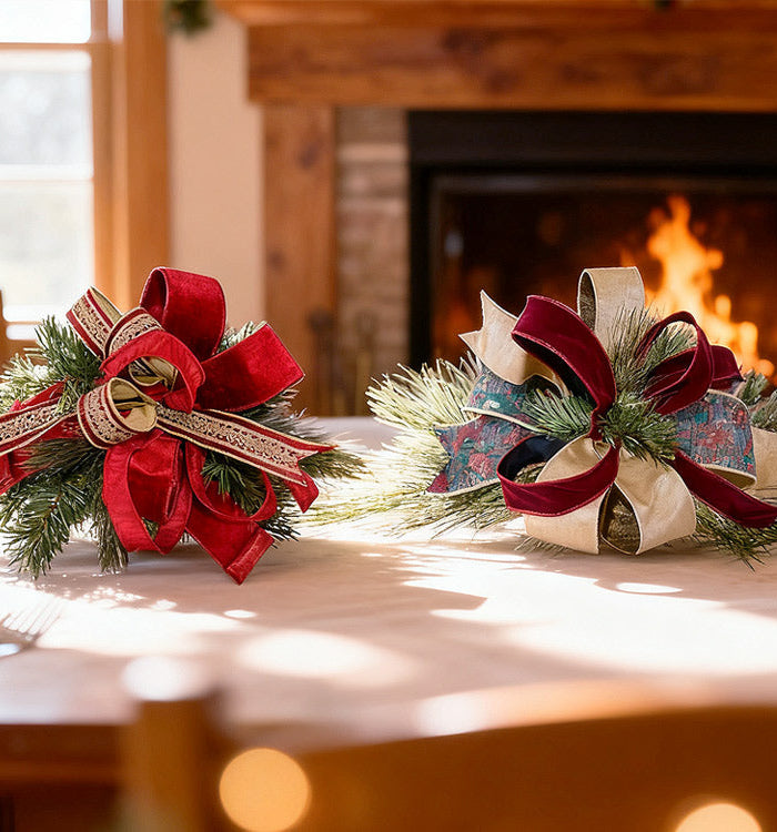 Colorful velvet ribbons on spools with gold edges, surrounded by Christmas ornaments like small trees and baubles, ideal for holiday crafting and decor
