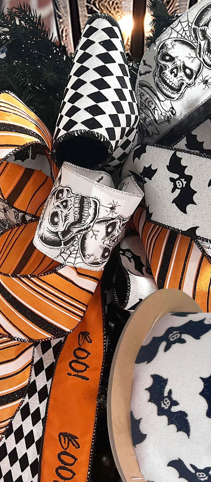 Halloween wired ribbons with skulls, bats, and festive patterns, arranged as bows. Perfect for Halloween decor & crafts at LaRibbons and Crafts.