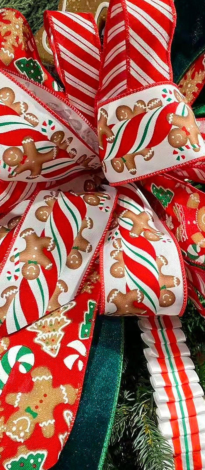 Christmas tree topper with gingerbread & candy cane wired ribbon bow. Holds shape well, perfect for holiday decor and wreaths, adding festive flair. | LaRibbons and Crafts