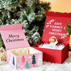 Several beautifully designed Christmas gift boxes with various patterns, placed around a Christmas tree, creating a warm and festive holiday atmosphere.