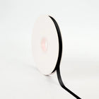Spool of black single-face satin ribbon, smooth sheen for gift wrapping & crafts.