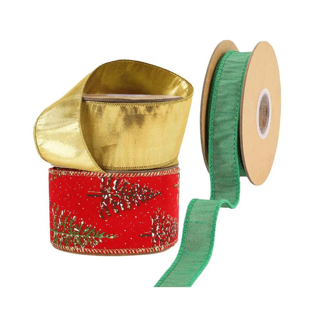 Three spools of Christmas ribbons: a metallic gold ribbon, a red ribbon with glittery pine tree patterns, and a green ribbon.