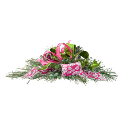 Christmas ribbon ornament with pink peppermint print, green & pink ribbons, paired with pine branches, ideal for holiday decor.
