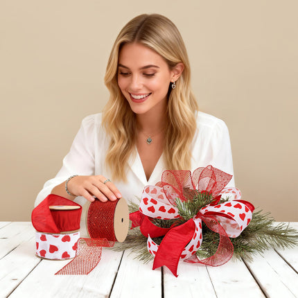 Valentines Ribbon Craft: Woman using heart/mesh red ribbon rolls to make decor