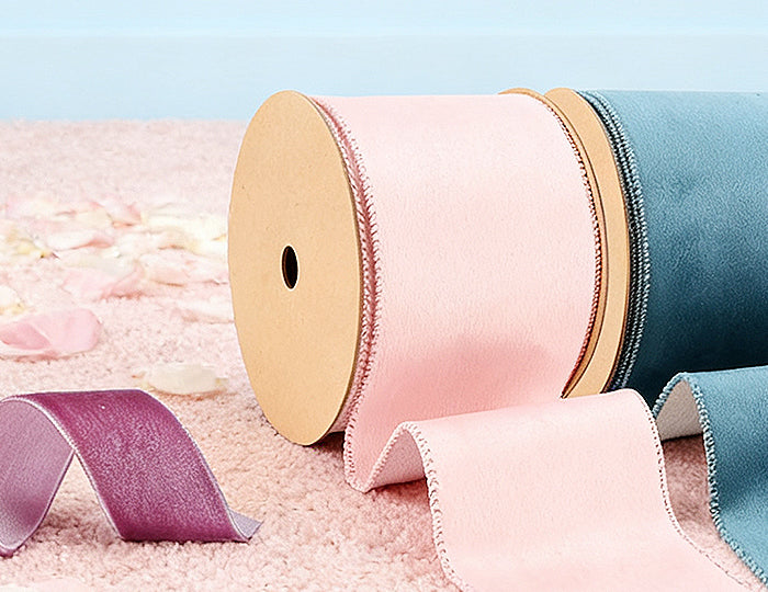 Velvet ribbon rolls (pink/teal/silver) with neat stitched edges – ideal for wedding/party decor crafts.