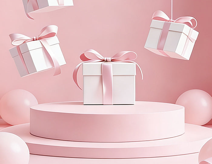 Pink single face satin ribbon (on white gift boxes) — smooth, ideal for gift wrapping & celebrations.