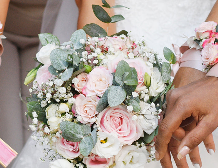 Pale pink satin ribbon wristbands: paired with wedding floral corsages for bridesmaids.