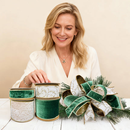 Woman with four Christmas ribbon rolls & bow on table. Velvet, patterned (gold details).