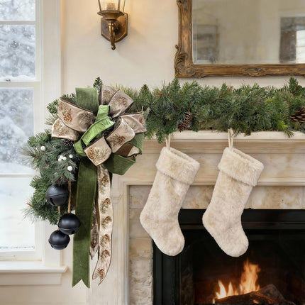 Christmas fireplace decor: green garland, pinecone bow, velvet ribbons & fluffy stockings