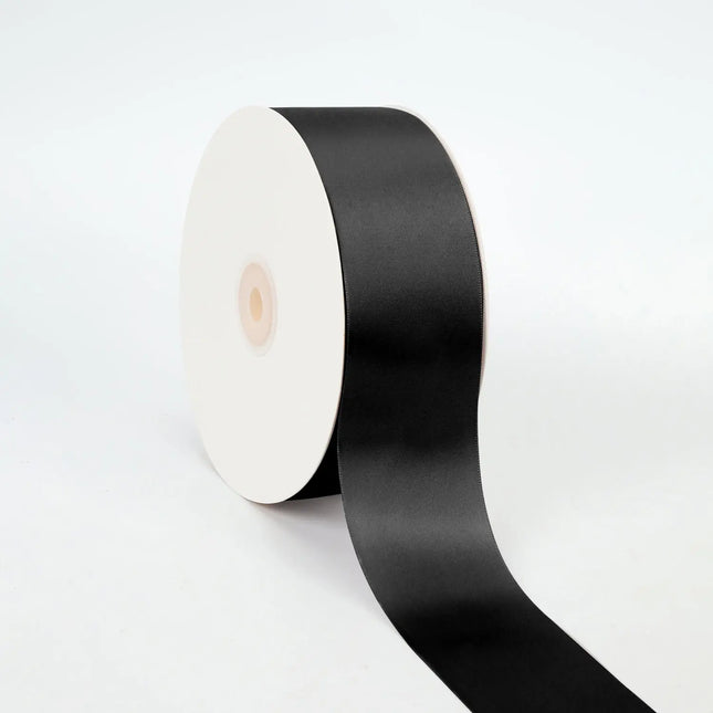 Spool of black double-face satin ribbon smooth sheen for gift wraps