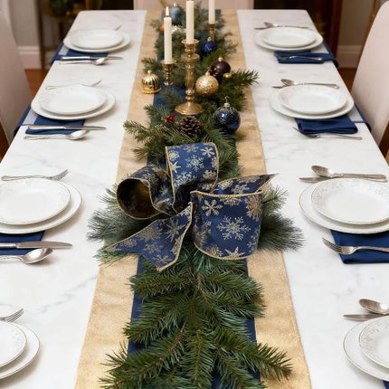 Navy & gold snowflake wired jacquard ribbon as a centerpiece on a Christmas dining table, adding luxurious charm.