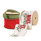 Three spools of Christmas ribbons: green, white 