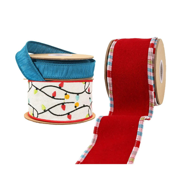Assorted Christmas ribbons – blue, festive light-patterned, red with plaid trim – ideal for holiday decor.