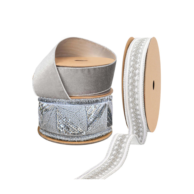 Three spools of premium silver Christmas ribbons: sparkling sequined, soft velvet, and delicate lace-patterned, boasting intricate textures and eye-catching designs.