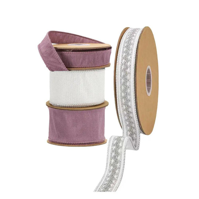 Four spools of ribbon: three stacked spools with purple and white textured ribbons, and a separate spool of white ribbon with intricate silver embroidery.