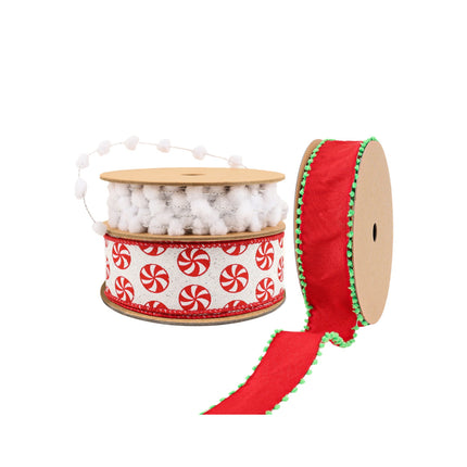 Three festive ribbons: a white pom-pom ribbon, a red-and-white peppermint-patterned ribbon, and a red ribbon with green pom-pom trim.