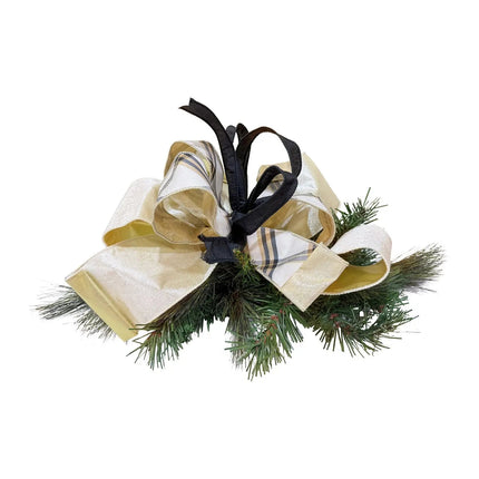 A decorative piece with green pine foliage, featuring gold, plaid-patterned, and black ribbons. Ideal for elegant gift wrapping and festive decor.