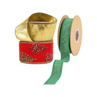 Three spools of Christmas ribbons: a metallic gold ribbon, a red ribbon with glittery pine tree patterns, and a green ribbon.