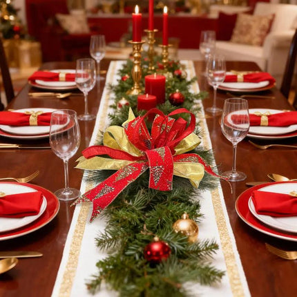 Festive ribbons—red with glitter pine patterns and metallic gold—adorn green pine in the Christmas dining table centerpiece.
