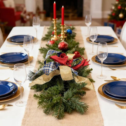 A Christmas table centerpiece features ribbons: red, gold metallic, and blue plaid with gold, white, and beige patterns.