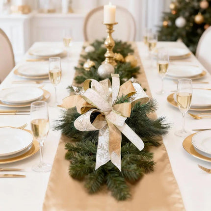 Christmas dining table adorned with a stunning bow of golden snowflake and lace ribbons, creating a festive ambiance for holiday gatherings.