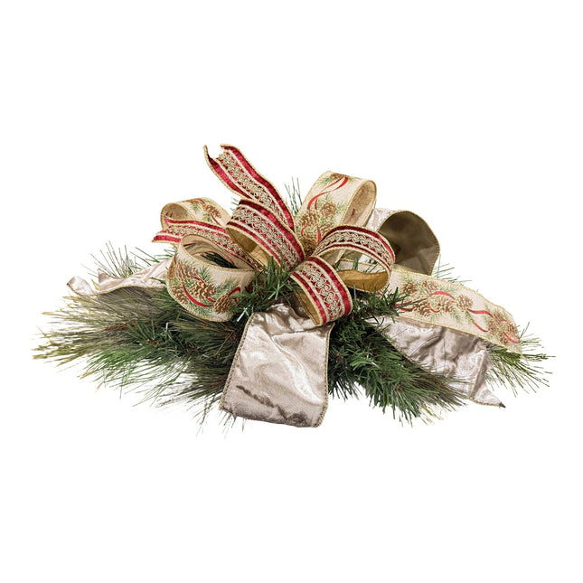 Christmas decor piece with pine foliage, pine cone-print ribbon, red-gold embroidered ribbon, and metallic gold velvet ribbon.