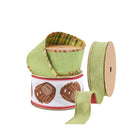 Assorted spools of ribbon including green plaid, green textured, and a baseball glove-patterned design, ideal for decor and sports-themed crafts.
