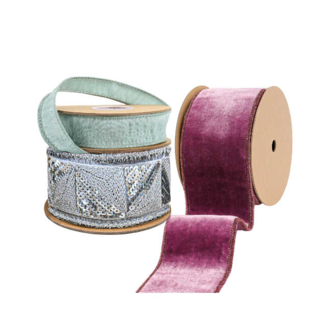 Three spools of wired edge ribbons: light green woven, silver sequin-fringed, and plush gradient purple velvet, ideal for decor.