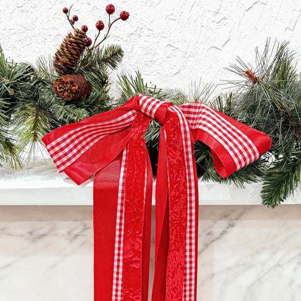 Red-white gingham ribbon bow: layered satin, vibrant red for holiday decor.