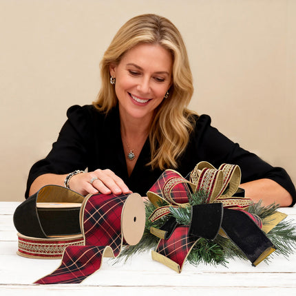 Lady with plaid/velvet ribbons + pine bow – luxe festive decor.