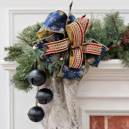 Mantel decor: navy-gold snowflake ribbon bow + burgundy-gold embroidered trim.