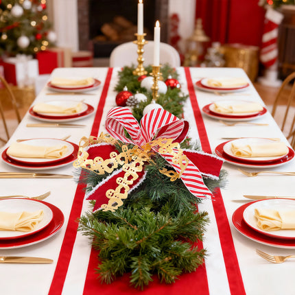 A festive Christmas dining table with Candy Cane ribbon, red velvet ribbon,pine centerpiece, gold gingerbread ribbon.