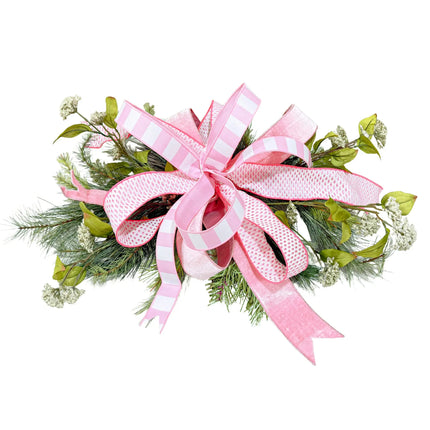 Pink multi-pattern wired ribbon bow with greenery for wreaths and decor.