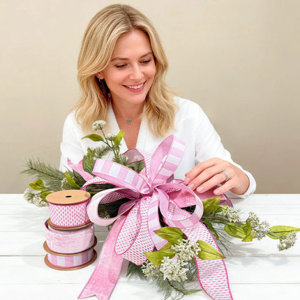 Pink striped, woven dot, and velvet ribbon bundle styled into a multi-layered bow, ideal for spring decor.