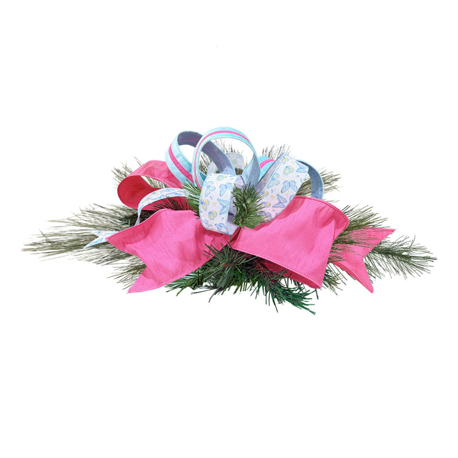 Spring bow centerpiece with pink linen, aqua stripe, & butterfly ribbons.