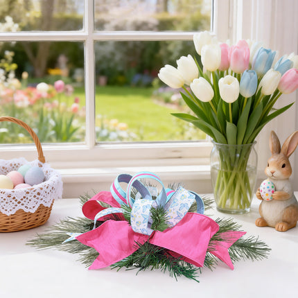 Spring window decor with ribbon bow, eggs, tulips, and bunny figurine.