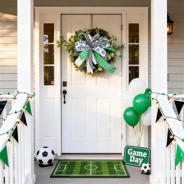 Soccer game day front porch decor with greenery wreath, black-white-green bow