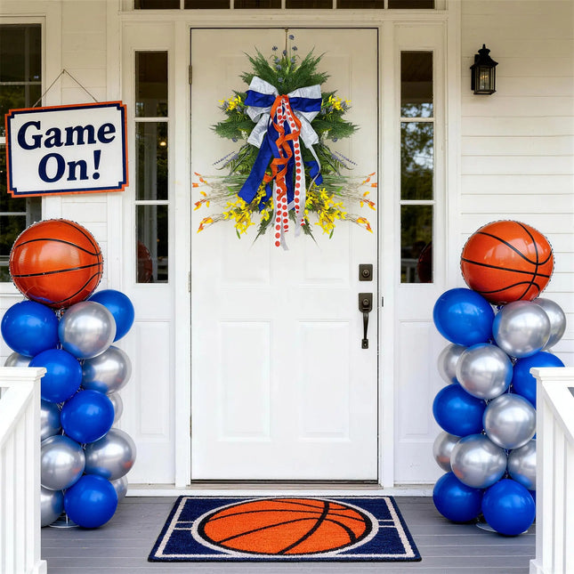 Basketball-themed front door decor with a team spirit wired ribbon bow, balloons, and "Game On!" sign for sports game day celebrations.