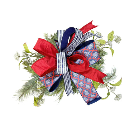 Patriotic multi-pattern wired ribbon bow featuring red-white-blue flame, blue geometric, and red dupioni ribbons