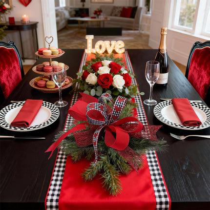 Valentine table: check/hearts/mesh ribbon decor with plates, flowers & champagne