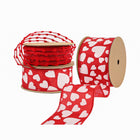 Spools of Valentine’s Day ribbons: red & white heart patterns, textured red pom-pom ribbon