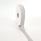 Spool of Shell Grey grosgrain ribbon, unrolled to display its textured weave.