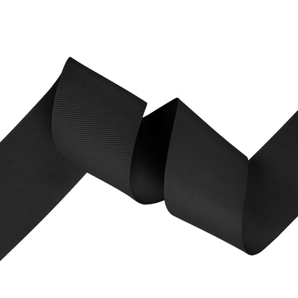Black textured grosgrain ribbon, curled to show smooth ribbed texture
