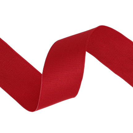 Red textured grosgrain ribbon , ideal for sewing, scrapbooking, and festive arrangements.