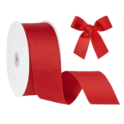 Bright red grosgrain ribbon spool with matching bow, smooth and sturdy for gift wrapping