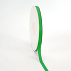 Spool of Emerald grosgrain ribbon, unrolled to display its textured weave.