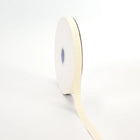 Spool of ivory grosgrain ribbon, unrolled to display its textured weave.