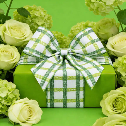 4" Wired Green Grid on White Linen Ribbon Bow on a Green Gift Box, Surrounded by Light Green Roses